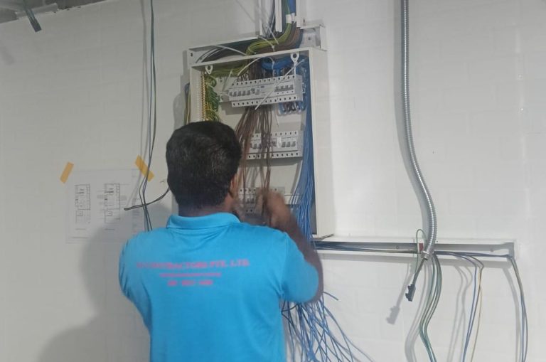 VF Contractors electrician rewiring a distribution board