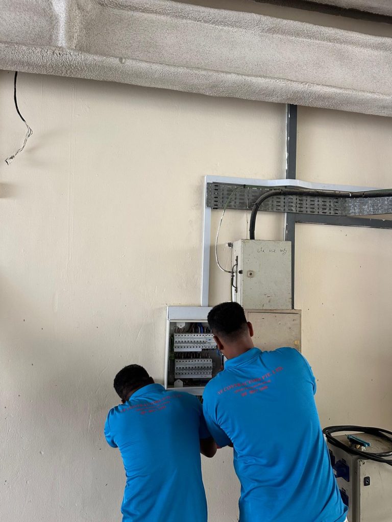 VF Contractors electricians working on a distribution board